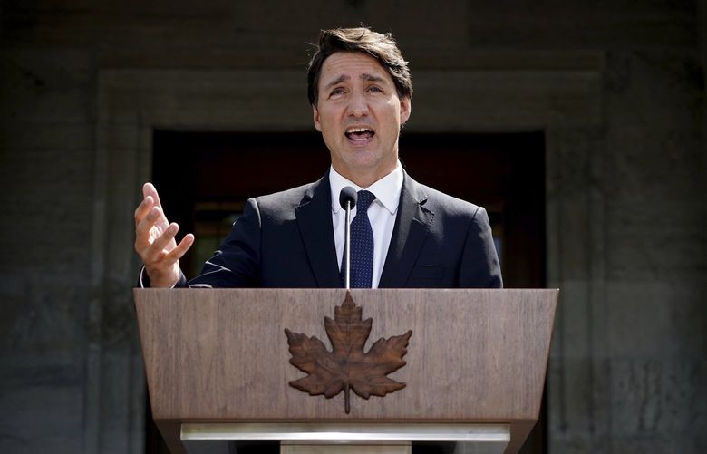 Prime Minister Justin Trudeau speaks to media following a meeting with Gov. Gen. Mary Simon at Rideau Hall in Ottawa, Ontario, on Sunday, Aug. 15, 2021. (Sean Kilpatrick/The Canadian Press via AP) SKP209 SKP209