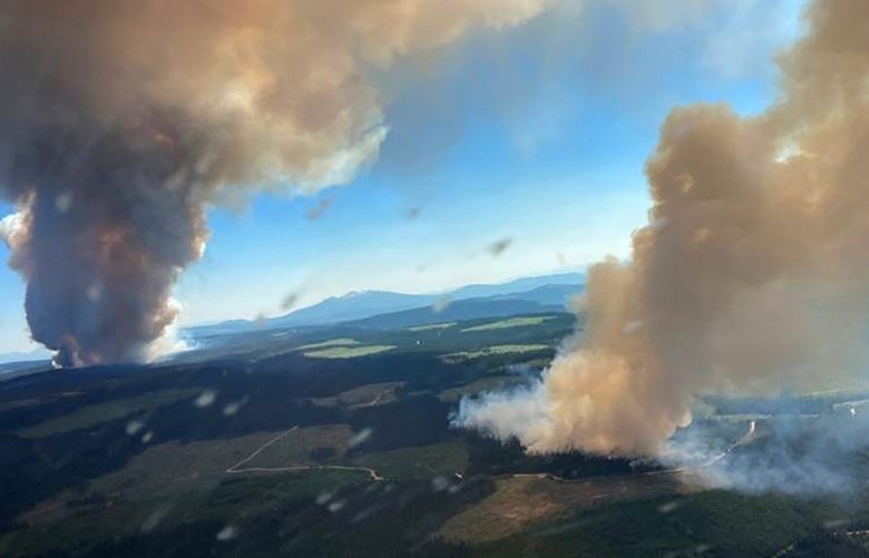 **EMBARGO: No electronic distribution, Web posting or street sales before THURSDAY 3:01 A.M. ET AUG. 12, 2021. No exceptions for any reasons. EMBARGO set by source.** FILE – A photo provided by the BC Wildfire Service shows two plumes of smoke from the Long Loch wildfire and the Derrickson Lake wildfire on June 30, 2021, in Canada’s British Columbia province. Authorities are urging residents to obey evacuation orders, in the worst wildfire season since a horrible one in 2018. (BC Wildfire Service via The New York Times) — FOR EDITORIAL USE ONLY WITH NYT STORY CANADA WILDFIRES EXPLAINER BY VJOSA ISAI FOR AUG. 11, 2021. ALL OTHER USE PROHIBITED. — XNYT68 XNYT68