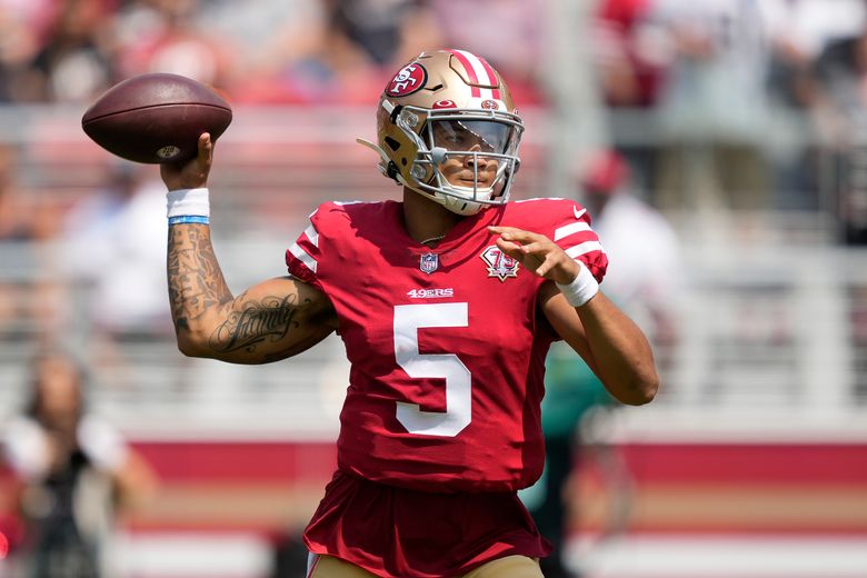 Trey Lance of the San Francisco 49ers looks to pass against the