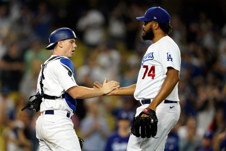 Los Angeles Dodgers catcher Will Smith throws to second base during a