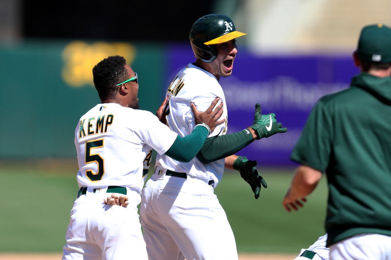 Tony Kemp of the Oakland Athletics celebrates on second after