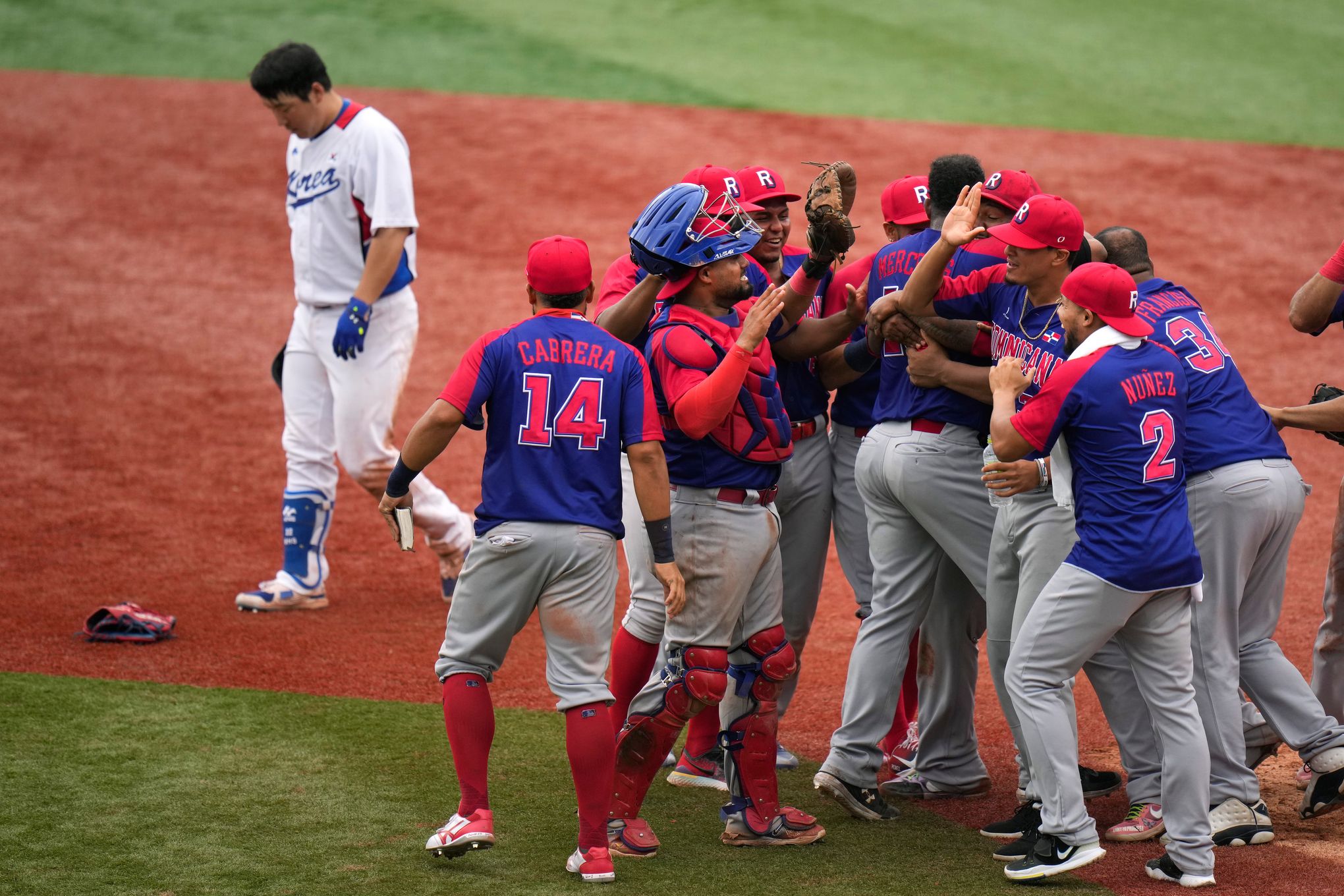 Dominican champion Juan Guzman, right, connects with a right