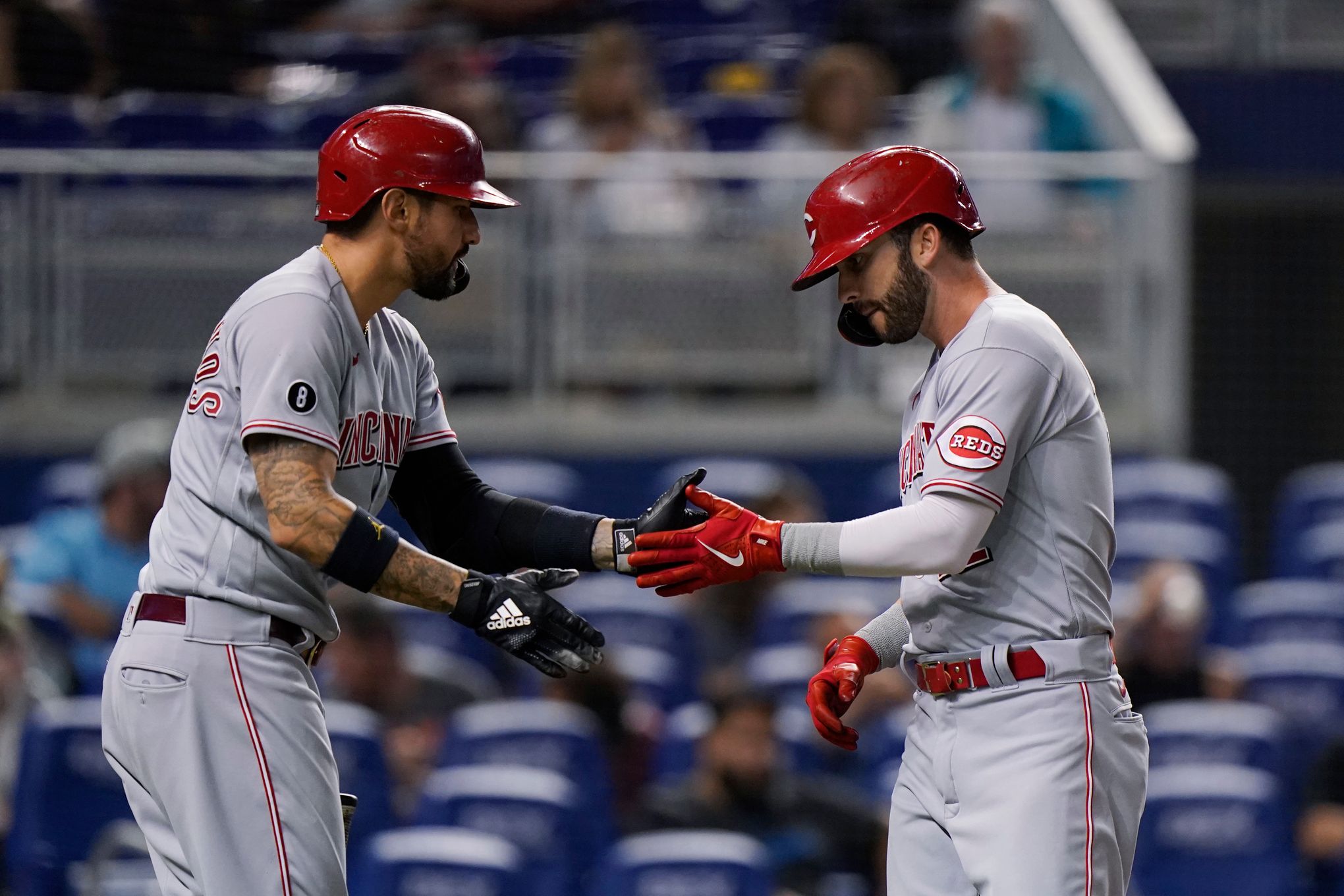 Miley goes 7, Naquin extends streak, Reds beat Marlins 6-0