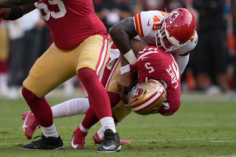 San Francisco 49ers quarterback Trey Lance (5) drops backs to pass