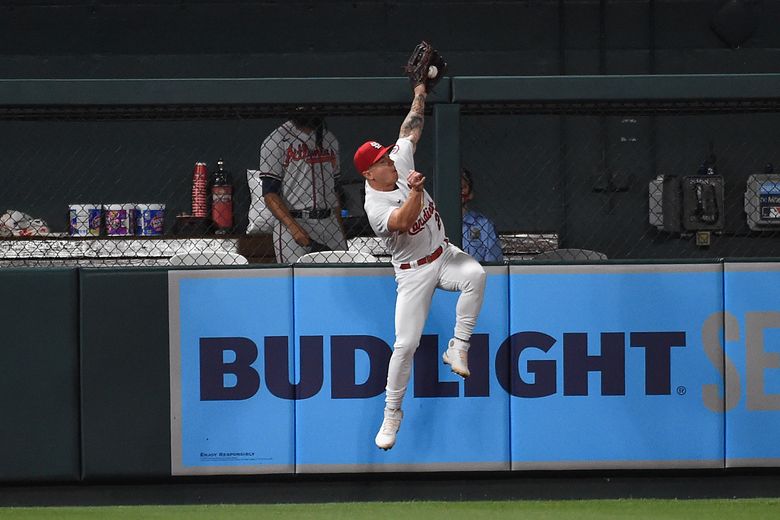 Tyler O'Neill of the St. Louis Cardinals catches a deep fly ball