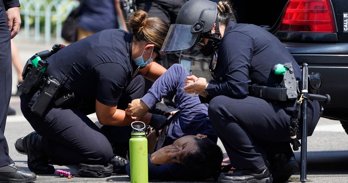 Man stabbed, reporter attacked at protest at LA City Hall | The Seattle ...