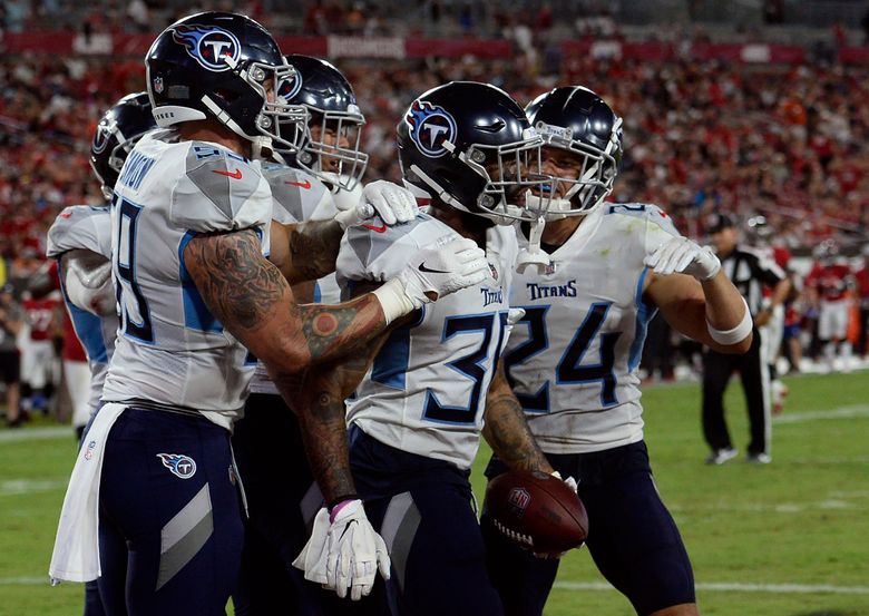 Titans defense shuts down Brady-less Buccaneers 34-3