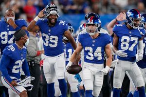 Running back Sandro Platzgummer of the New York Giants attempts to