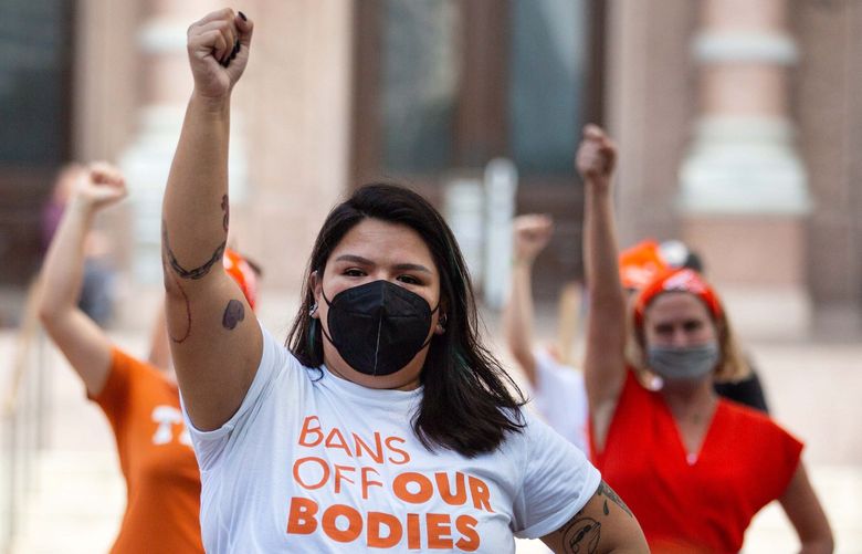 Demonstrators protest against the new state law creating an almost complete ban on abortions in Texas, outside the State Capitol in Austin, Wednesday, Sept. 1, 2021. Businesses that expressed opposition to restrictive voting laws are declining to take a similar stand on the abortion measure. (Montinique Monroe/The New York Times)  XNYTF