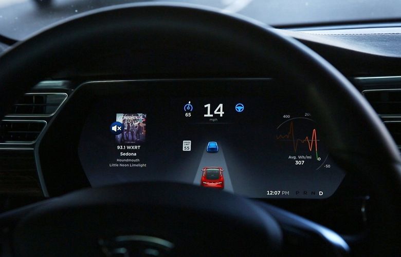 The dashboard of the software-updated Tesla Model S P90D shows the icons enabling Tesla’s autopilot, featuring limited hands-free steering. Car-hacking is more of a threat than most realize. (Chris Walker/Chicago Tribune/TNS) 25391621W 25391621W