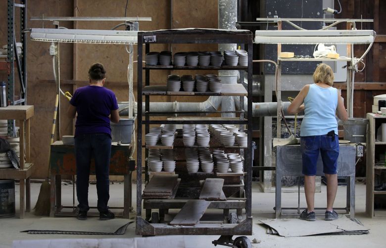 Workers manufacture dinnerware at the Fiesta Tableware Co. factory in Newell, West Virginia, U.S., on Thursday, July 22, 2021. Markit is scheduled to release manufacturing figures on August 2. Photographer: Luke Sharrett/Bloomberg