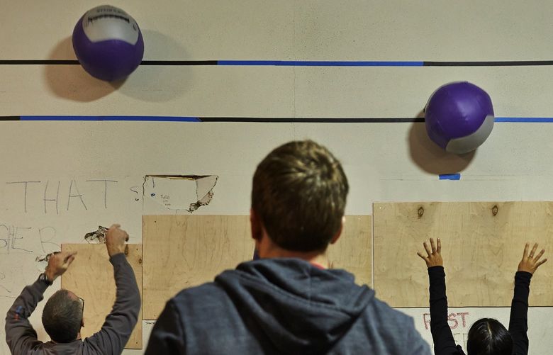 Pacific Northwest Magazine. Fitness story. Cross Fit class at Rocket Cross Fit. Instructor Jeremiah Derksen, center, watches as members go through their workout. Story ID: