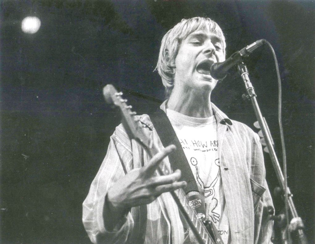 Kurt Cobain belts out a song in Nirvana’s 1992 concert at Seattle Coliseum. (Benjamin Benschneider / The Seattle Times)