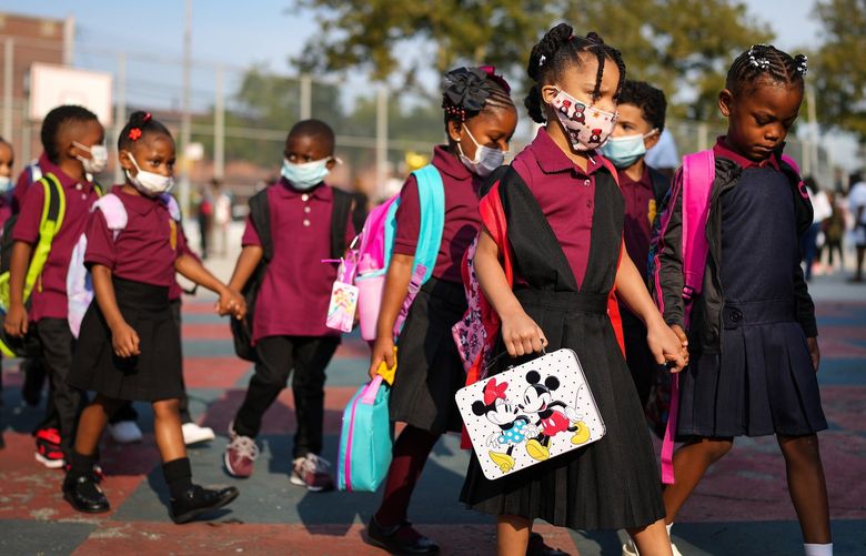 Students arrive for the first day of the school year at Mott Hall Bridges Academy in Brooklyn on Monday, Sept. 13, 2021. New York City’s classrooms reopened on Monday to roughly a million children, most of whom were returning for the first time since the United States’ largest school system closed in March 2020 due to the coronavirus pandemic. (Chang W. Lee/The New York Times) XNYT42 XNYT42