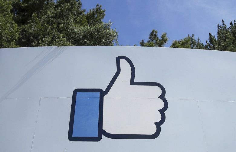 The thumbs up Like logo is shown on a sign at Facebook headquarters in Menlo Park, Calif., Tuesday, April 14, 2020. Facebook has deleted a post by President Donald Trump for the first time, saying it violated its policy against spreading misinformation about the coronavirus. The post in question featured a link to a Fox News video in which Trump says children are “virtually immune” to the virus. Facebook said Wednesday, Aug. 5, 2020 that the “video includes false claims that a group of people is immune from COVID-19 which is a violation of our policies around harmful COVID misinformation.” (AP Photo/Jeff Chiu) NYPS217