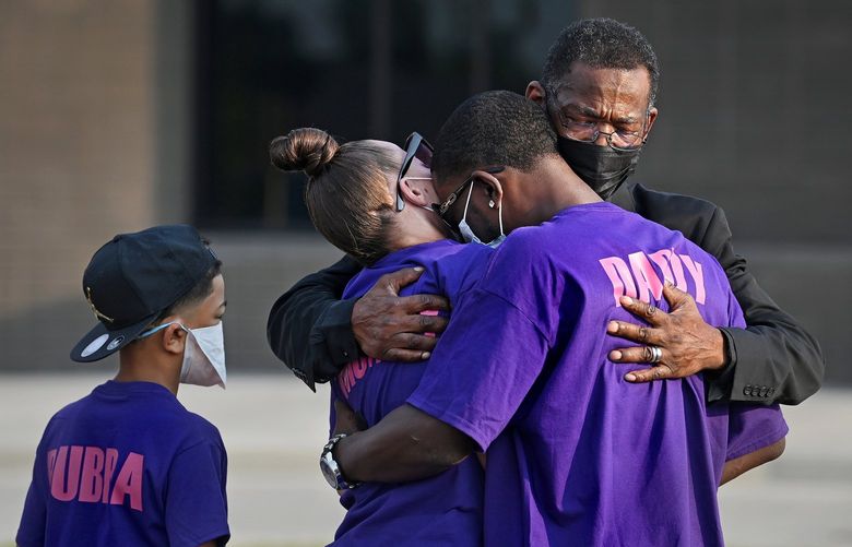 Jordyn’s mother and father, Caylenn and Ricky Franklin, are comforted by pastor Leanell McClenton, rear, on Aug. 6, as her brother, Jaydon, 10, looks on. MUST CREDIT: Washington Post photo by Michael S. Williamson