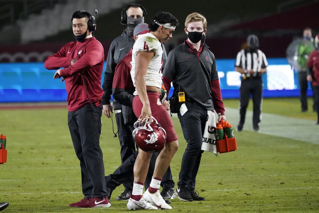Jayden de Laura walks off the field after an injury during the second half during a game against USC in Los Angeles, Dec. 6, 2020. (Alex Gallardo / AP)