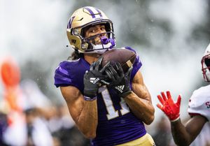 Washington Huskies finally get a win with 52-3 romp over Arkansas State 