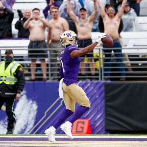 Washington Huskies finally get a win with 52-3 romp over Arkansas State 