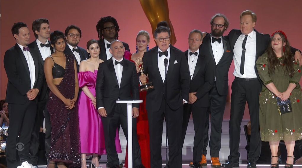 Stephen T. Colbert, center, and the cast and crew of “Stephen Colbert’s Election Night 2020: Democracy’s Last Stand Building Back America Great Again Better 2020” accept the award for outstanding variety special during the Primetime Emmy Awards. Joining them from right are presenter Aidy Bryant and Conan O’Brien. (Television Academy via The Associated Press)