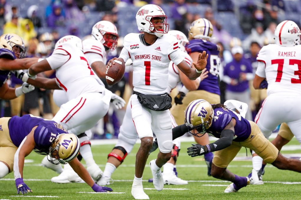Washington Huskies defensive back Brendan Radley-Hiles gets to Arkansas State Red Wolves quarterback James Blackman for a sack during the third quarter, Sept. 18, 2021, in Seattle. (Jennifer Buchanan / The Seattle Times)
