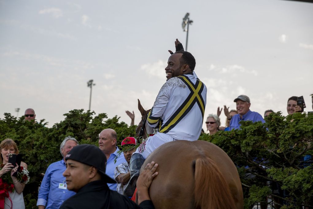 Background ridden by jockey Rocco Bowen wins at the 86th Longacres Mile Handicap, Aug. 15, at Emerald Downs in Auburn. (Sylvia Jarrus / The Seattle Times)