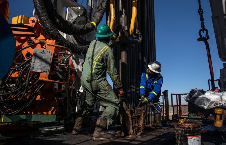 FILE — Floorhands work on a drilling rig contracted to Shell in the Delaware Basin, near Wink, Texas, on Jan. 25, 2019. Royal Dutch Shell sold its oil and gas production in the Permian Basin, the biggest American oil field, to ConocoPhillips for $9.5 billion in cash on Monday, Sept. 20, 2021. (Tamir Kalifa/The New York Times) XNYT92 XNYT92