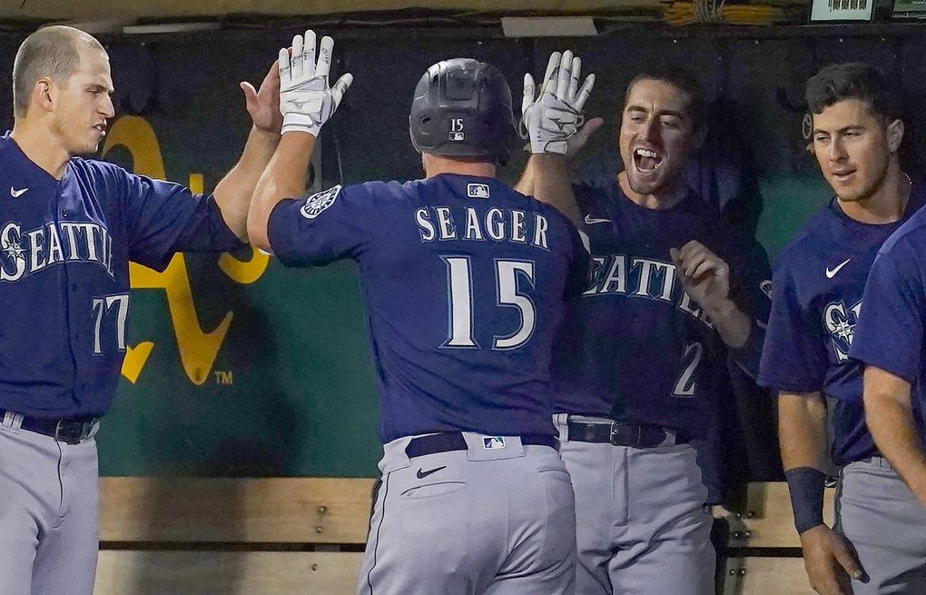 Mariners beat Athletics 5-2 to stay in AL wild-card chase