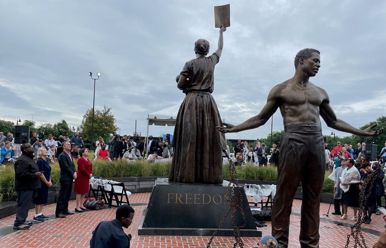 Virginia Gov. Ralph Northam and state Sen. Jennifer McClellan, D-Richmond, look at Richmond’s newly unveiled Emancipation and Freedom monument Sept. 22, 2021. MUST CREDIT: Washington Post photo by Gregory S. Schneider