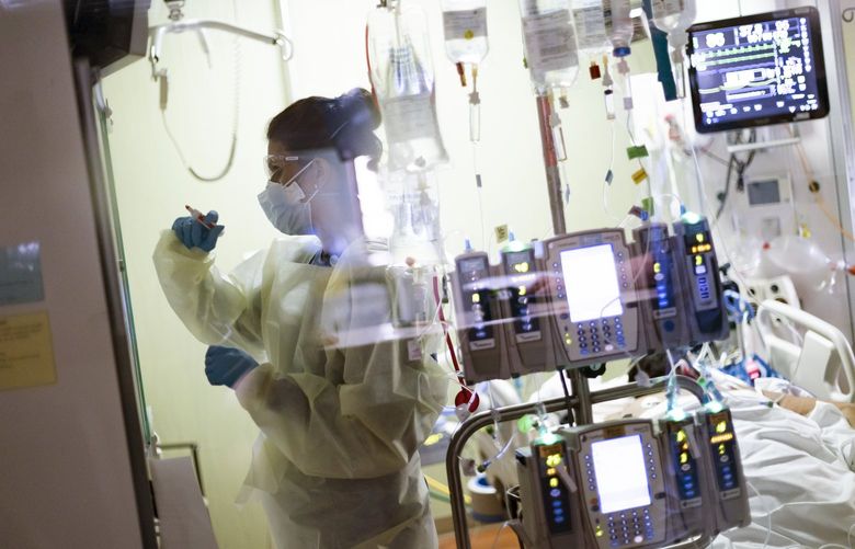 FILE – In this Aug. 31, 2021, file photo, Ann Enderle R.N. attends to a COVID-19 patient in the Medical Intensive care unit (MICU) at St. Luke’s Boise Medical Center in Boise, Idaho. COVID-19 deaths in the U.S. have climbed to an average of more than 1,900 a day for the first time since early March, with experts saying the virus is preying largely on a select group: 71 million unvaccinated Americans. (AP Photo/Kyle Green, File) NYAG902 NYAG902
