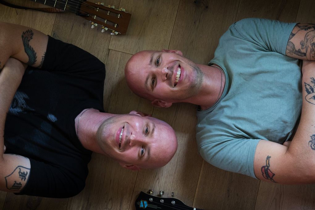 Twins and perennial Brandi Carlile collaborators Tim and Phil Hanseroth say “In These Silent Days” unlocked a new level for the band. “We knew we wanted to do something different, but we weren’t sure quite how to do that, and I think we’ve just now figured it out at the end of the process,” Phil Hanseroth says. (Ellen M. Banner / The Seattle Times)