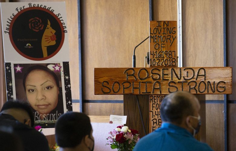 Photos of Rosenda Strong surround a cross at her funeral at Valley Hills Funeral Home Friday, Sept. 24, 2021 in Wapato, Was. (Evan Abell / Yakima Herald-Republic)