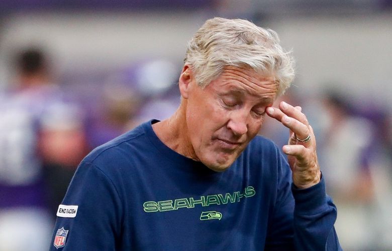 U.S. Bank Stadium – Seattle Seahawks at Minnesota Vikings – 092621
Seattle Seahawks head coach Pete Carroll wipes his face as he leaves the field after a loss to the Minnesota Vikings Sept. 26, 2021, in Minneapolis. 218322