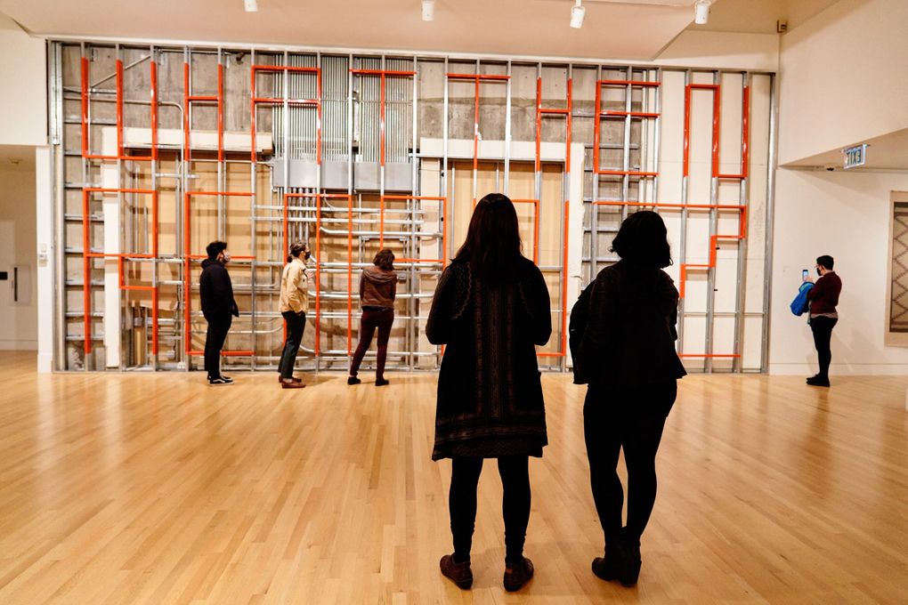 Visitors to the Frye Art Museum view Duane Linklater’s “What Then Remainz.” (Jonathan Vanderweit)