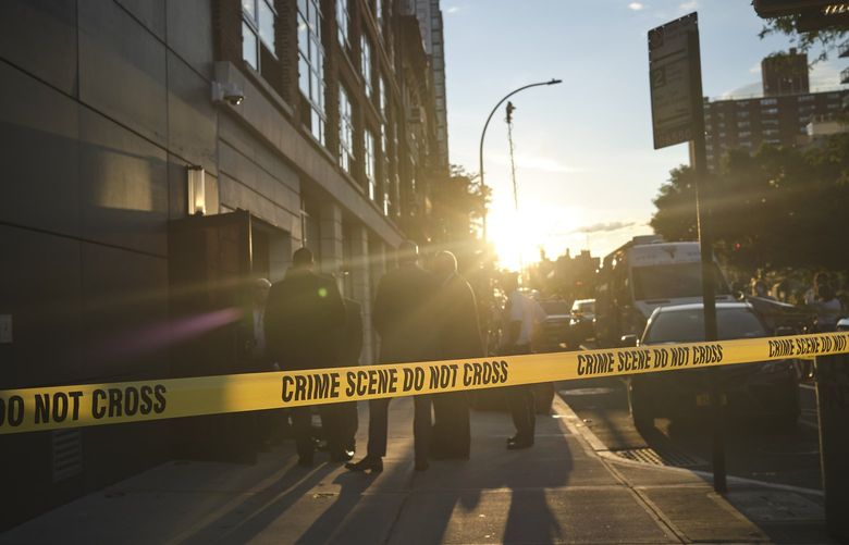 FILE — Police at the scene of a homicide in Manhattan on Tuesday, July 14, 2020. The United States experienced its biggest one-year increase on record in murders in 2020, according to new figures released Monday, Sept. 27, 2021, by the FBI, with some cities hitting record highs. (John Taggart/The New York Times) XNYT27 XNYT27