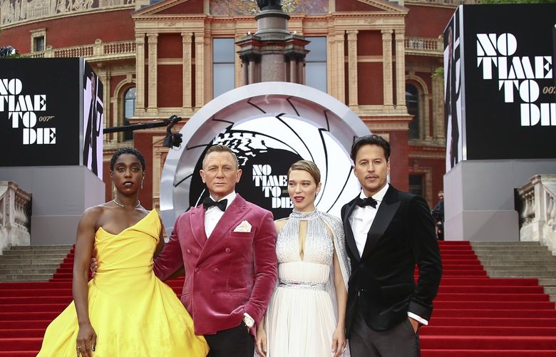 Lashana Lynch, from left, Daniel Craig, Lea Seydoux and Cary Joji Fukunaga pose for photographers upon arrival for the World premiere of the new film from the James Bond franchise ‘No Time To Die’, in London Tuesday, Sept. 28, 2021. (Photo by Joel C Ryan/Invision/AP) LENT165 LENT165