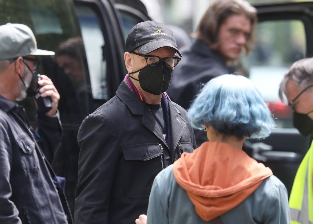 Director Steven Soderbergh, center, talks with “Kimi” star Zoë Kravitz while shooting in downtown Seattle in May. Interior scenes were shot in Los Angeles before the crew came to town to shoot outdoor scenes. (Ken Lambert / The Seattle Times)
