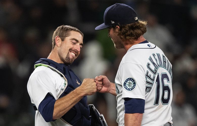 Catcher Tom Murphy congratulates relievers Drew Steckenrider on getting the save in Tuesday’s game with Oakland.
.
The Oakland Athletics played the Seattle Mariners in Major League Baseball Tuesday, September 28, 2021 at T-Mobile Park in Seattle, WA. 218349