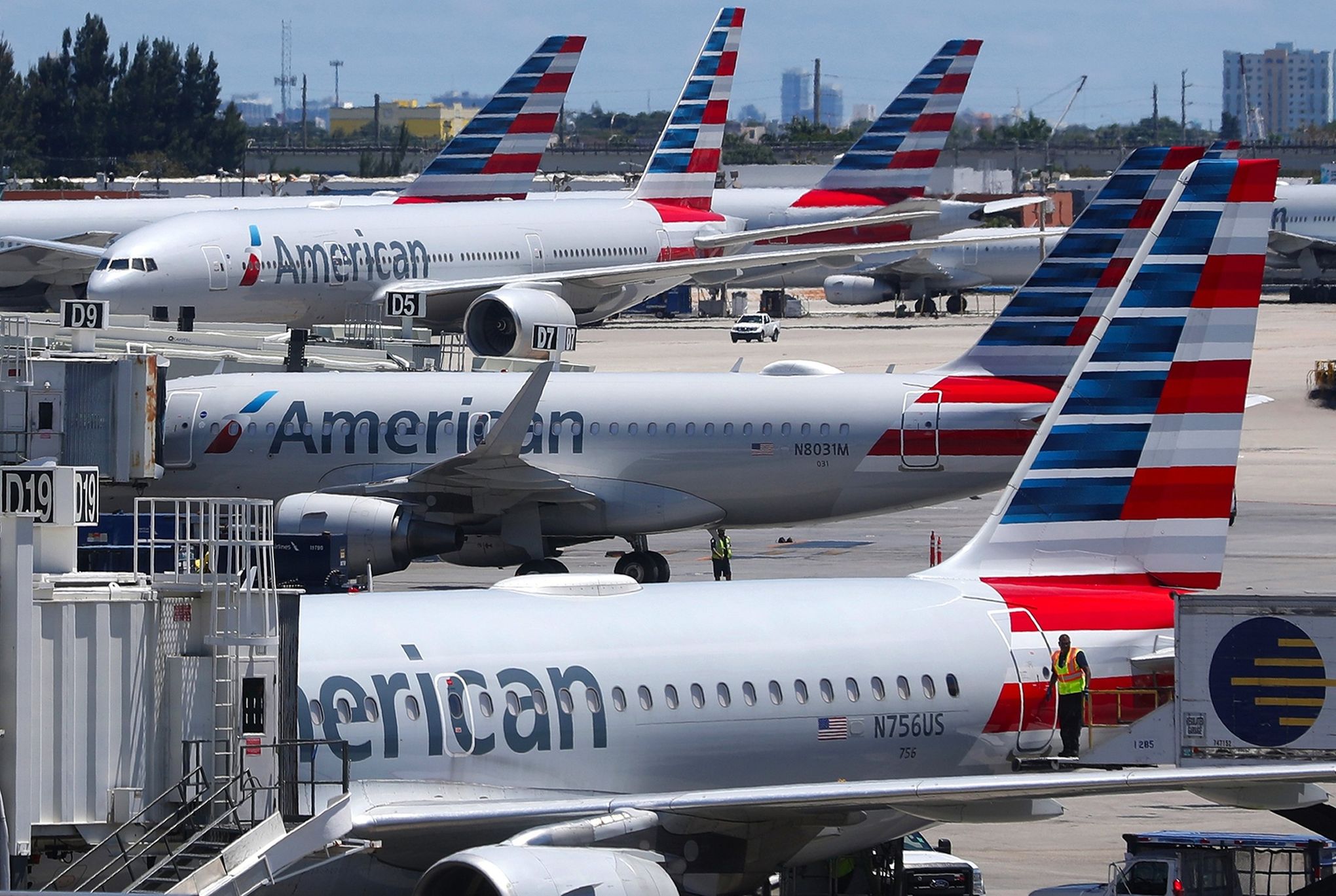 Passenger on flight arriving in Miami from Colombia opens plane door, jumps  on wing