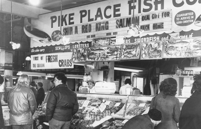 Charming Pike Place Market; with its Continental atmosphere, is especially noted for its fresh food and unusual merchandise. Fresh seafood is a popular feature. (Ron De Rosa / The Seattle Times)