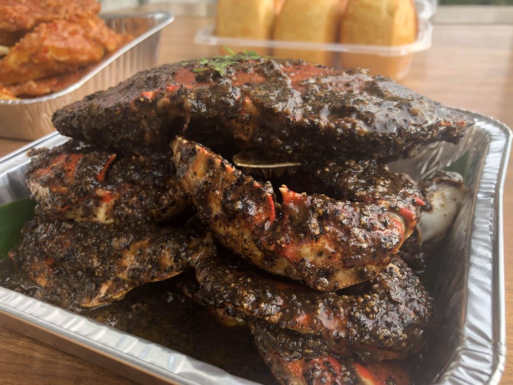 Marimakan’s Singapore black pepper crabs are loaded with two ice cream scoops of black pepper and lots of butter. (Jade Yamazaki Stewart / The Seattle Times)