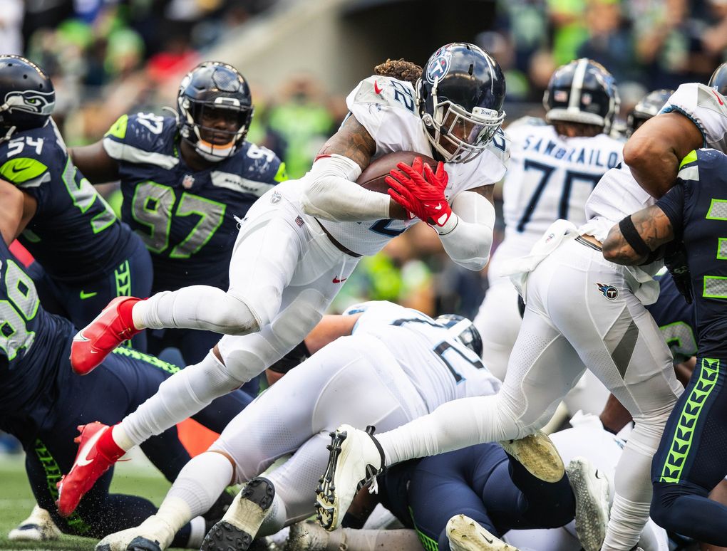 Tennessee running back Derrick Henry throws himself into the end zone on the 1-yard run, scoring the tying touchdown, ultimately sending the game into overtime. (Dean Rutz / The Seattle Times)