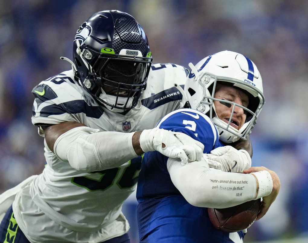 Seahawks linebacker Jordyn Brooks sacks Colts quarterback Carson Wentz the second half Sunday. (AJ Mast / AP)