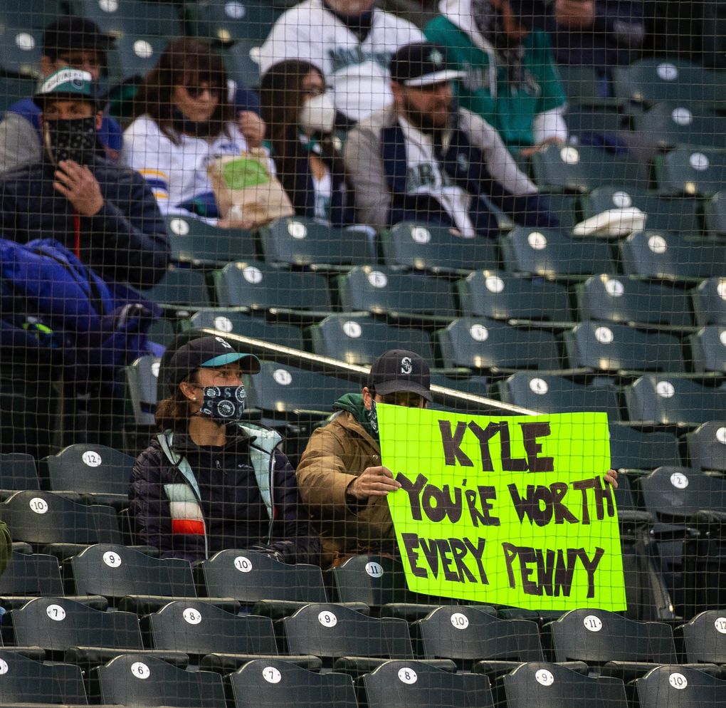 Fans along the thrid baseline have an opinion on Kyle Seager’s coming contract negotiation, April 6, 2021 in Seattle. (Dean Rutz / The Seattle Times)