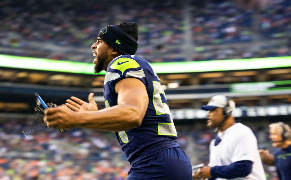 Bobby Wagner spots too many men on the field and tries to clear the errant player in the 1st quarter against the Denver Broncos in NFL preseason football Saturday, Aug. 21, at Lumen Field in Seattle. (Dean Rutz / The Seattle Times)