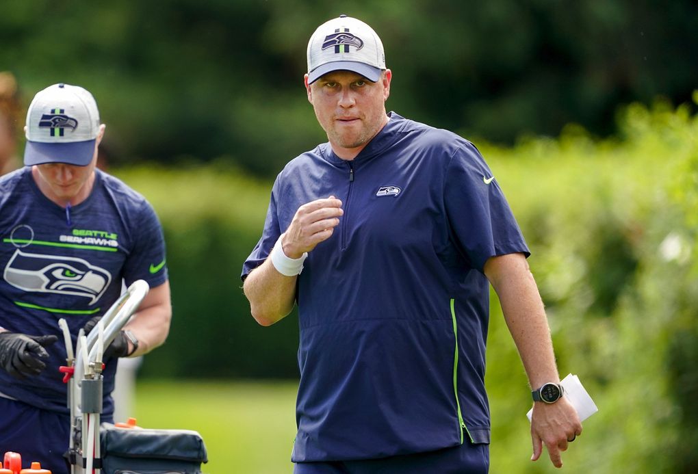 Seattle Seahawks offensive coordinator Shane Waldron, right, takes part in NFL football practice Wednesday, July 28, 2021, in Renton, Wash. (Ted S. Warren / The Associated Press)