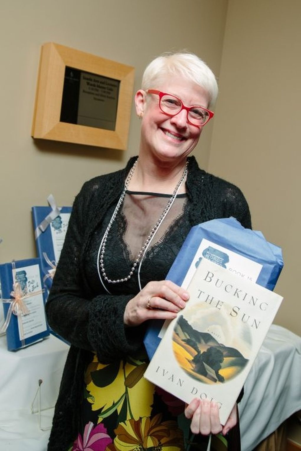 Diana Knauf with her surprise book from Seattle Arts & Lecture’s Date a Book initiative, in which participants receive a book wrapped anonymously in brown paper and see if they click with it. Knauf is a frequent Seattle Arts & Lectures audience member. (Courtesy of Diana Knauf)