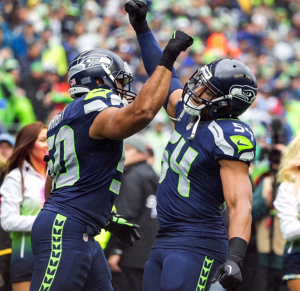 Linebackers K.J. Wright and Bobby Wagner greet each other during introductions before the Seattle Seahawks defeat the Atlanta Falcons 26-24 at CenturyLink Field in Seattle Sunday October 16, 2016. (Bettina Hansen / The Seattle Times)