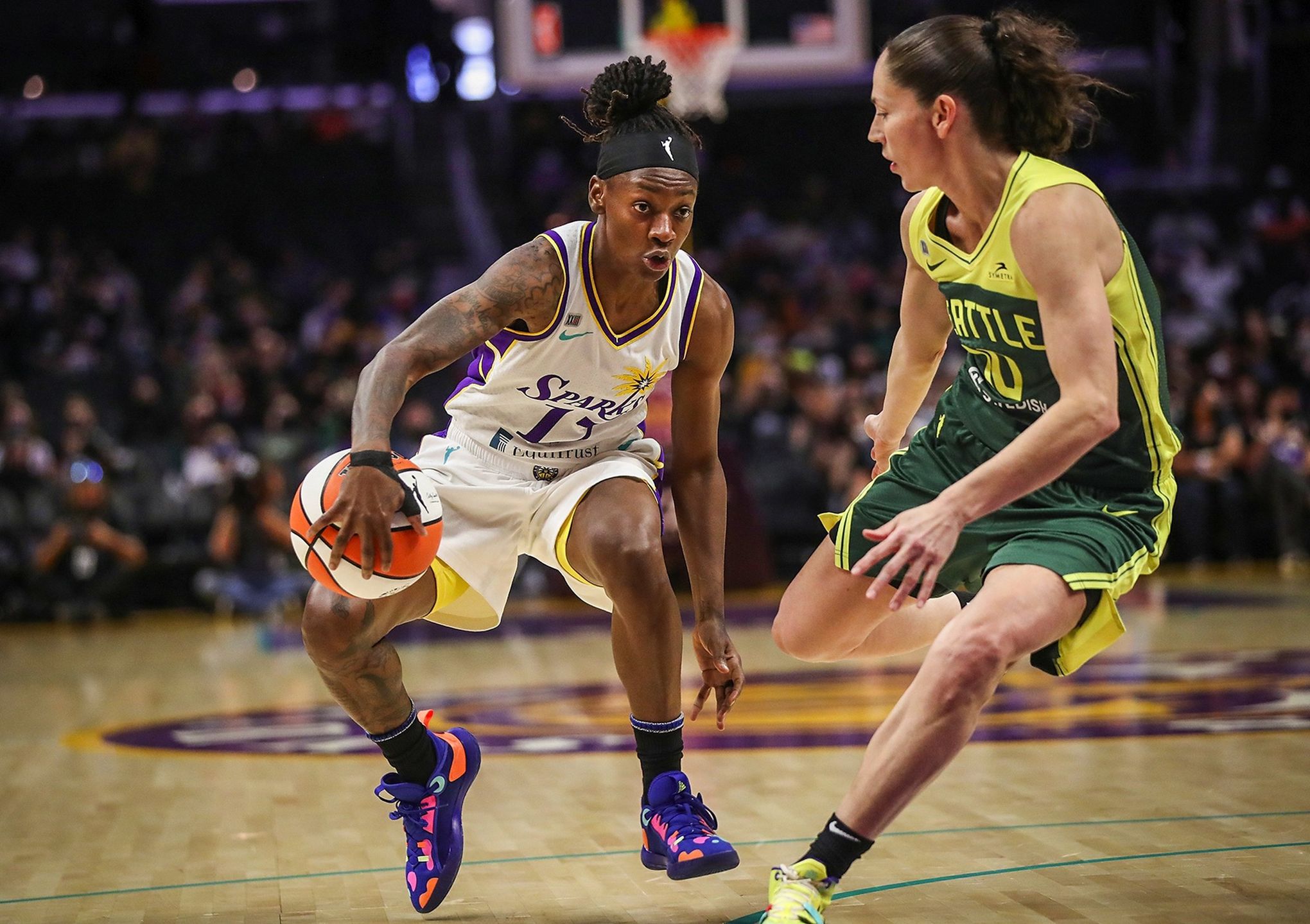 Los Angeles Sparks guards Jordin Canada (21), Te'a Cooper (2) and