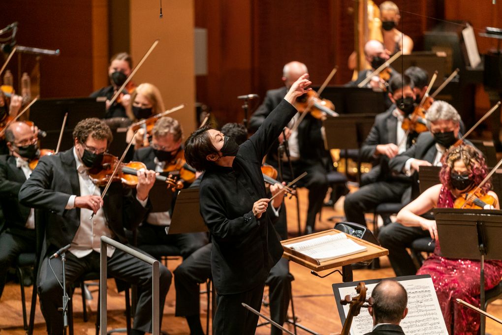 Xian Zhang conducts the Seattle Symphony Orchestra in its opening-night concert Sept. 18 after SSO music director Thomas Dausgaard, who was scheduled to conduct, could not come from Denmark, due to a stalled visa process stemming from COVID-19-related travel issues. (James Holt / Seattle Symphony)